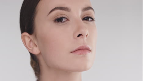 Beauty-portrait-of-woman-with-beautiful-face-tilting-head-up-slow-motion-skincare-concept-on-a-grey-background-slow-motion-Red-Epic-Dragon