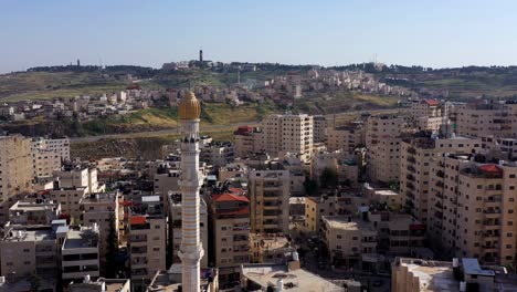 mosque tower minaret in shuafat refugee camp, jerusalem-aerial view