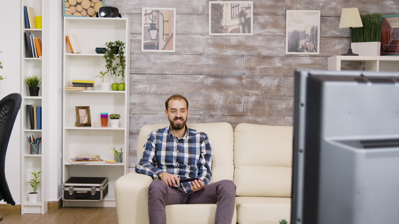 Man watching television in living room