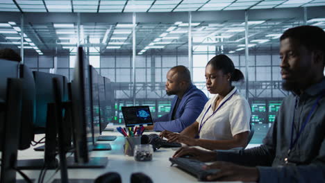 it staff monitoring data in server room
