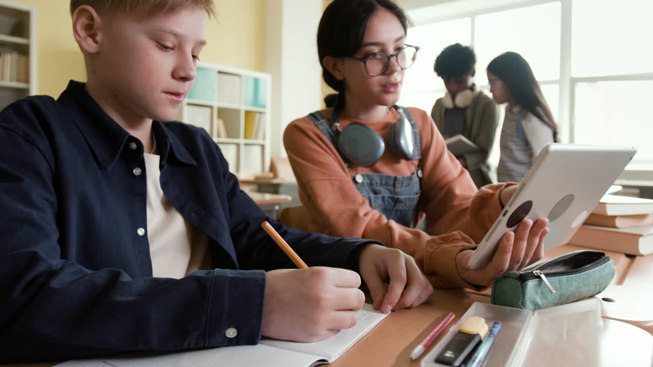 Students learning and using technology in a classroom