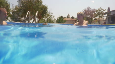 boy learning to swim under water