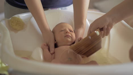 Mum-and-grandma-bathing-baby