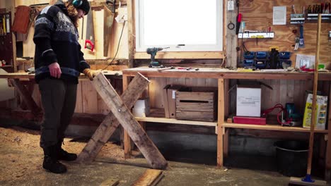 a man intends to create a sawbuck in indre fosen, trondelag county, norway - static shot