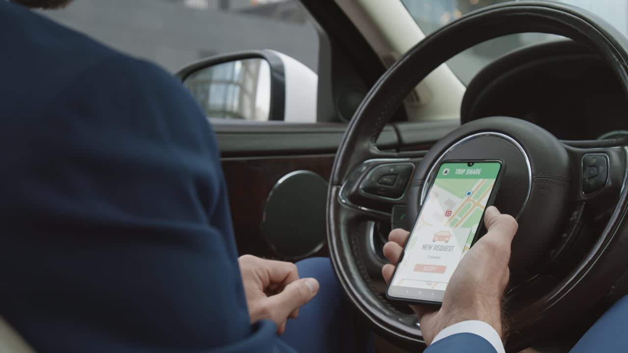 Driver Using Online Map in Car