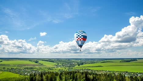 time lapse clouds in a beautiful summer landscape with a balloon, video loop