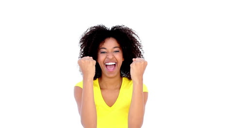 pretty girl in yellow tshirt cheering at camera