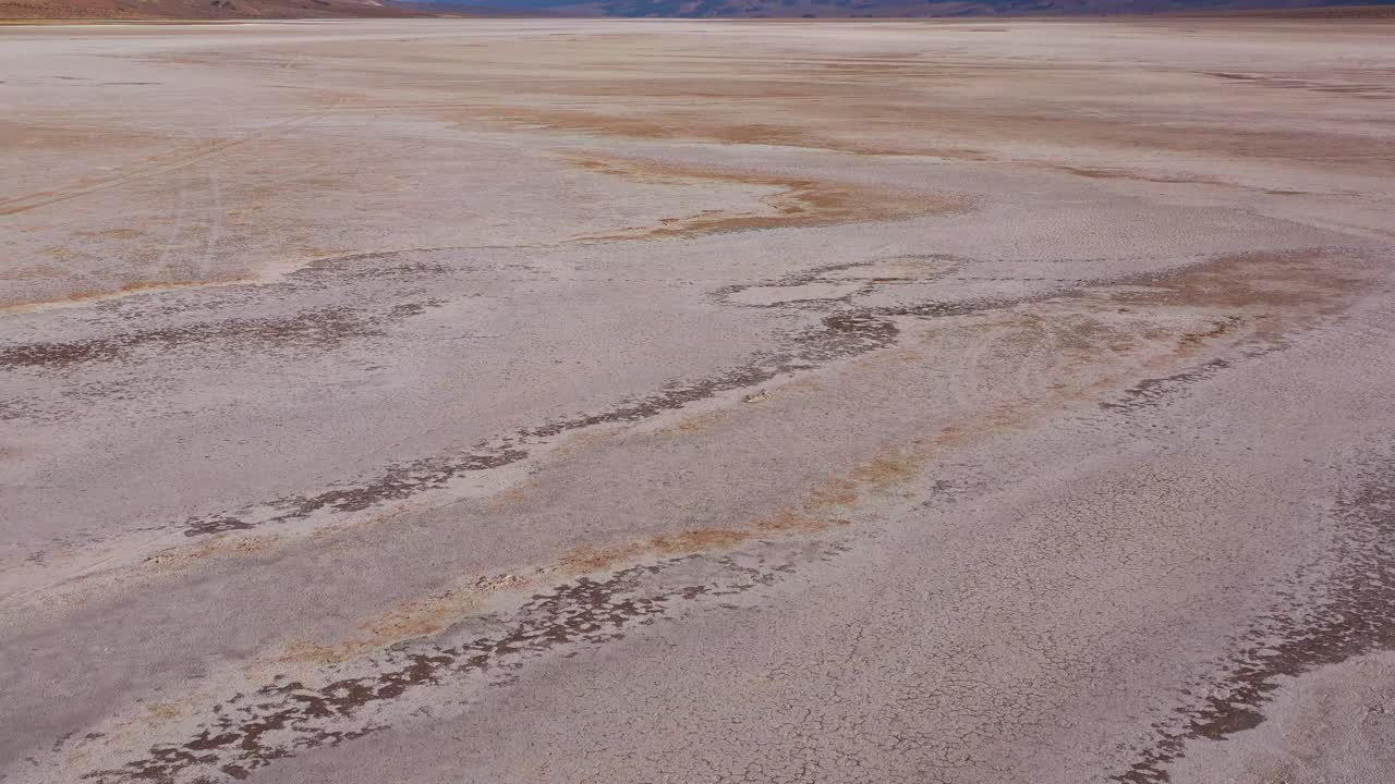 Nice low aerial over Death Valley National Park and a vast open desert playa 2