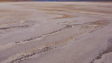 nice low aerial over death valley national park and a vast open desert playa 2