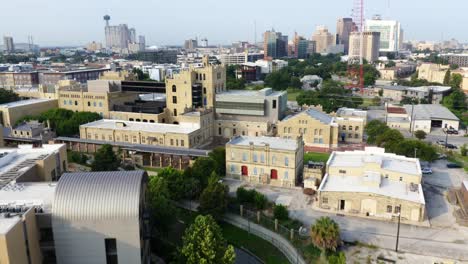 San-Antonio-Riverwalk-aerial-flyover-and-tilt-up-revealing-downtown-city-skyline-in-the-morning-with-4k-aerial-drone