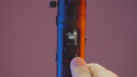 hand operating a smartphone gimbal