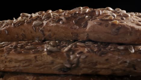 footage of rotating bread with flax and sunflower seeds