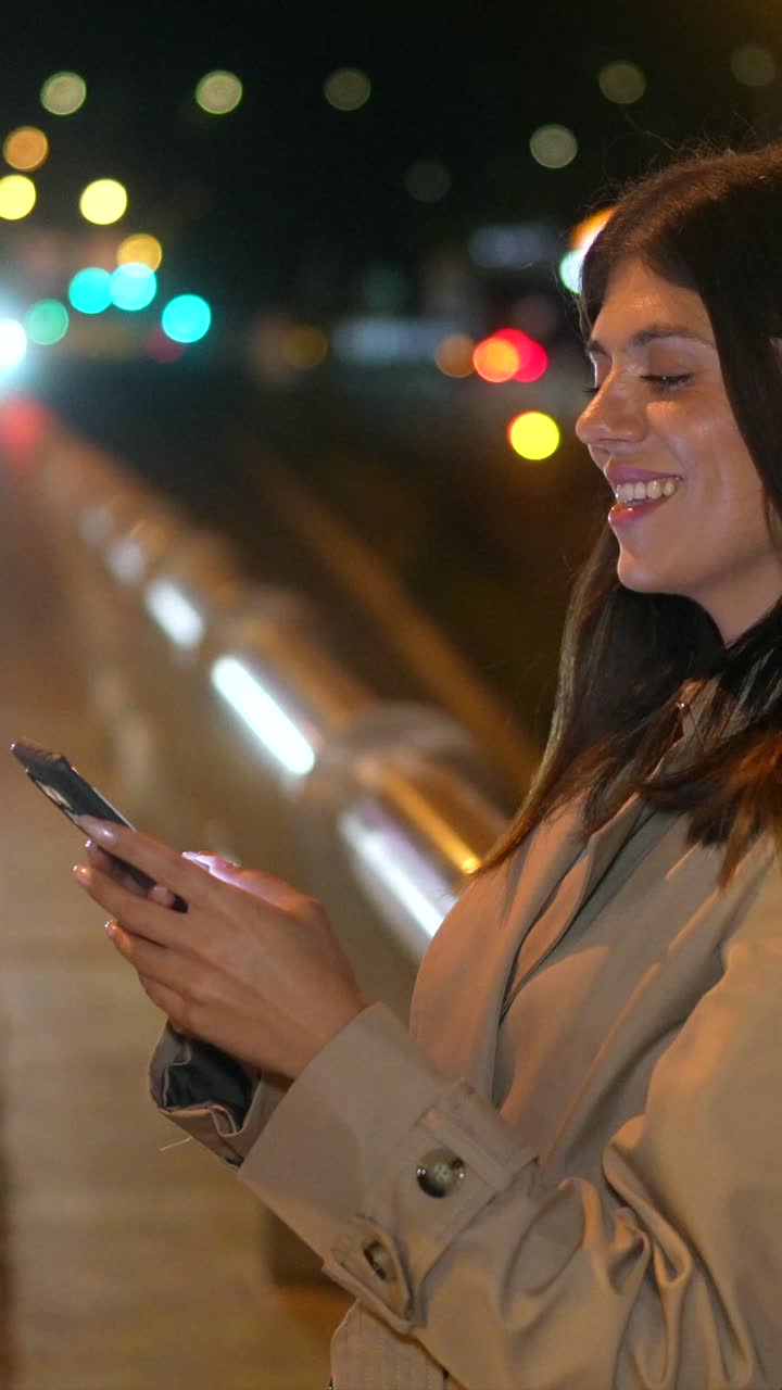 Woman Smiling in City Lights at Night