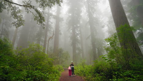 mother and daughter embrace in love together among beauty of nature