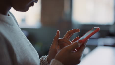 Close-up-of-womans-hands-using-smart-phone-technology-to-read-architectural-plans