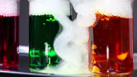 vibrant liquids react with dry ice, creating colorful bubbling effects in a science experiment setting