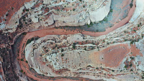 top view of dry empty riverbed in eroded landscape in utah