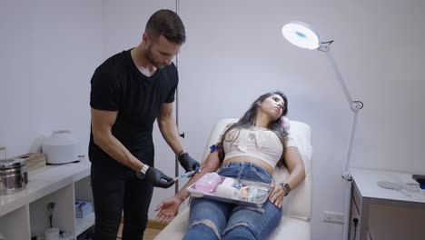 medical professional performing a procedure on a patient in a clinic