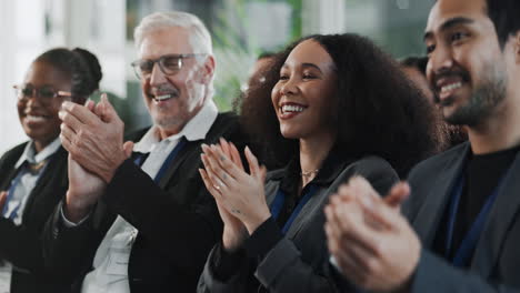 diverse group of business professionals applaud during a presentation