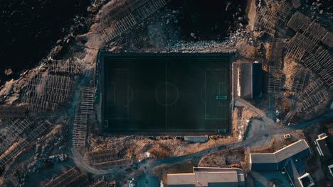 overhead view of soccer field in reine village, norway. - aerial ascend shot