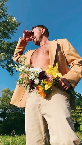 man with flowers in nature