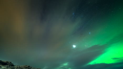 timelapse of green aurora borealis at night in skibotn, lyngen fjord in northern norway.