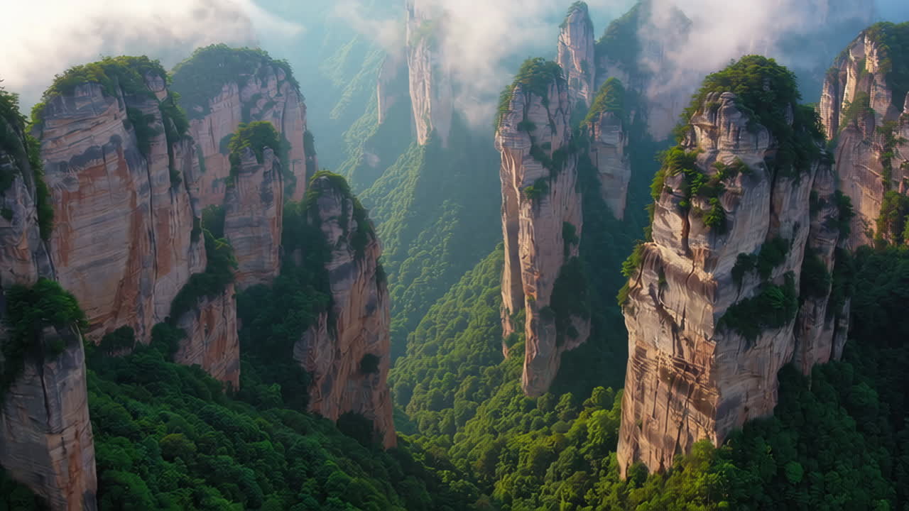 Majestic Green Valleys and Pillar Mountains Shrouded in Mist