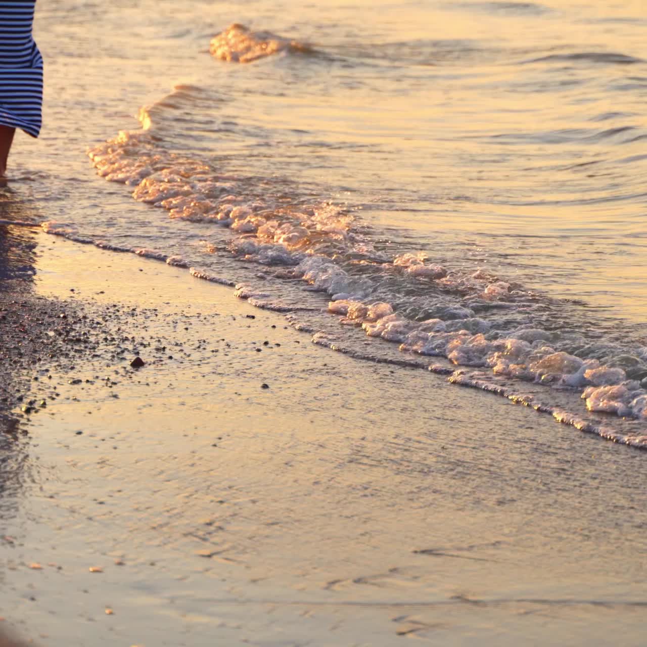 Lonely woman walking on beach