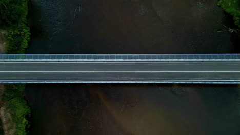 concrete bridge over flowing river. aerial topdown