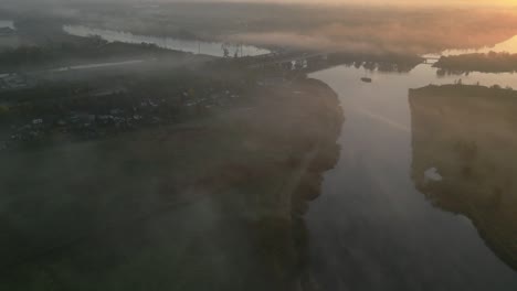 odra river in szczecin poland at dawn with mist over water and countryside captured from above