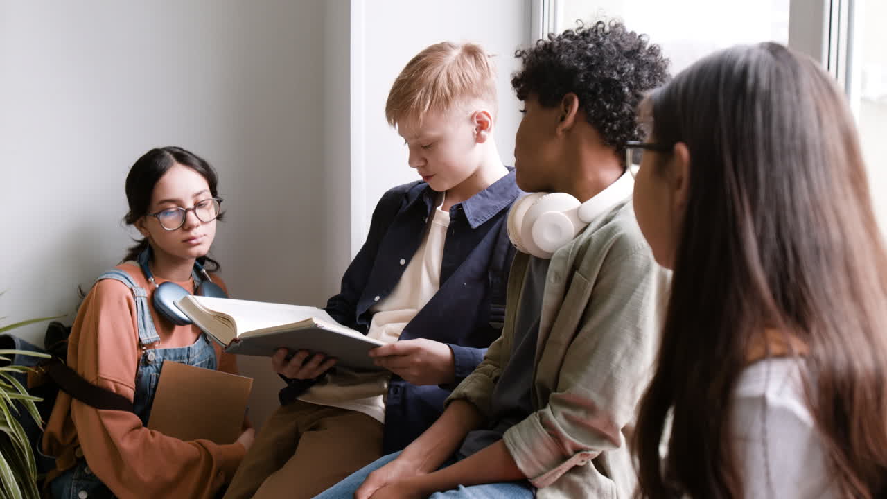 Diverse group of students reading and studying together