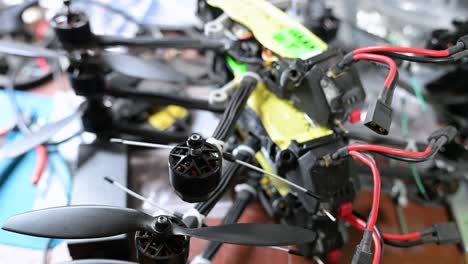 Close-up details reveal a custom-built FPV drone being weaponized in a Ukrainian workshop. This is the new face of low-cost, scalable warfare and homemade weaponry against Russia