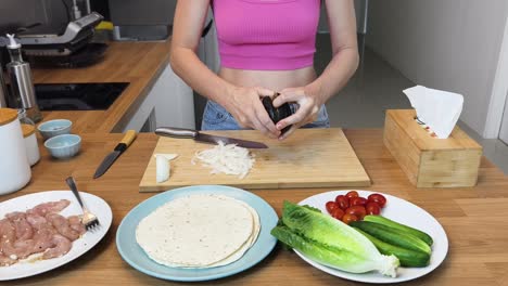 preparing a chicken avocado wrap