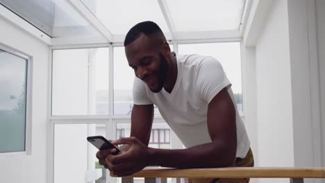 Young-adult-mixed-race-man-enjoying-time-at-home