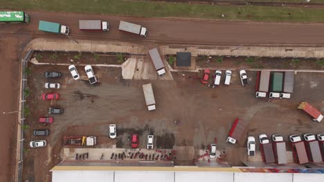 Dynamic-drone-shot-showcasing-parked-trucks-in-Misiones,-Posadas,-providing-a-unique-perspective-on-industrial-activities-and-logistics