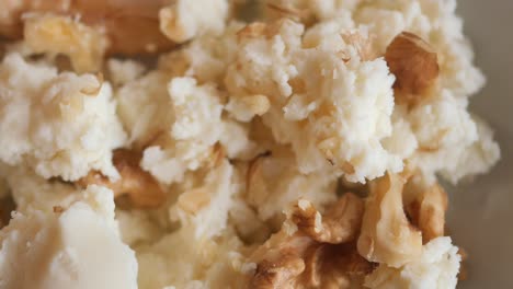 crumbled white cheese with walnuts