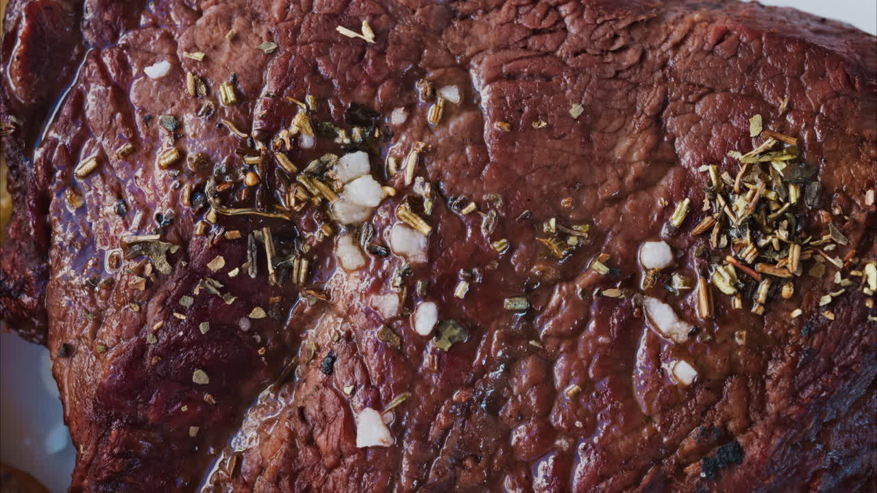 Close up of the condiments on a stake on a white plate at a restaurant