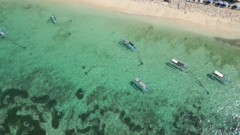 fishing boats floating in pantai pandawa lagoon uluwatu bali indonesia 4k 60fps