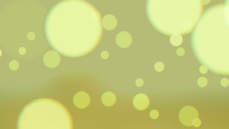 Falling-big-round-glitters-and-particles-on-yellow-and-fashion-background