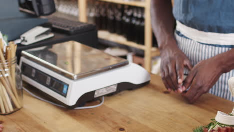 close up of customer making contactless payment for shopping at checkout of grocery store