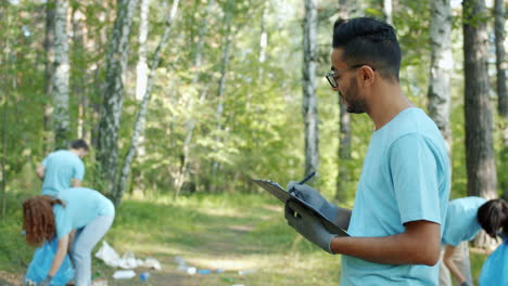 community volunteers cleaning up a forest