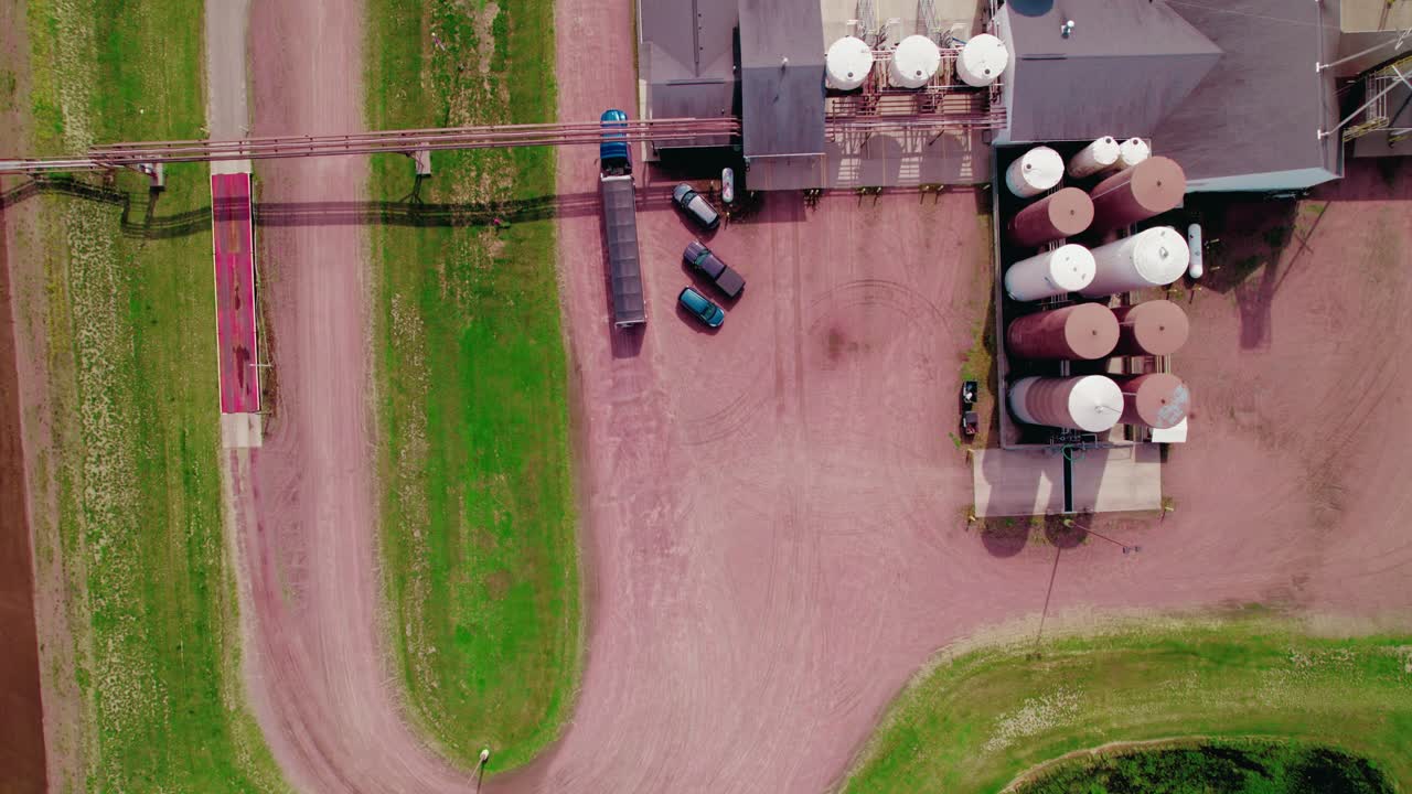 Grain hopper semi truck exiting a Silo Company Wisconsin Rapids, Wisconsin USA