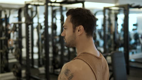 parallax effect - portrait fit sad dissapointed thougtful man in gym