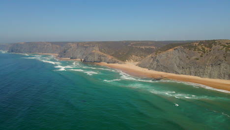 panoramic aerial view of the paradisiacal beach of cordoama on the vicentine coast on a sunny summer day, algarve, portugal