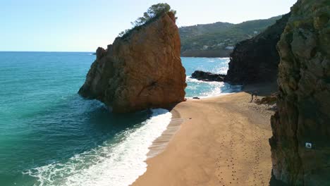 ilia roja beach on the costa brava of gerona, rock in the middle of the sea nudist beach , nature nudist