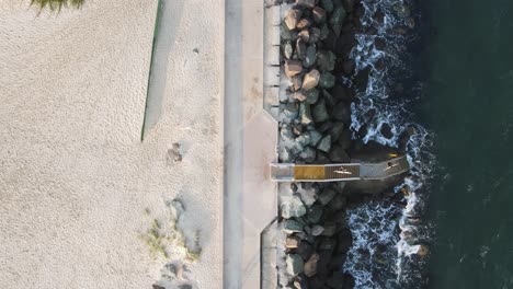 Surfers-using-a-newly-constructed-ocean-platform-and-stairs-providing-safe-access-to-the-surf-beach