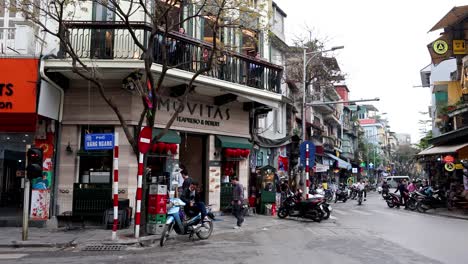 hanoi street scene with motorbikes and shops