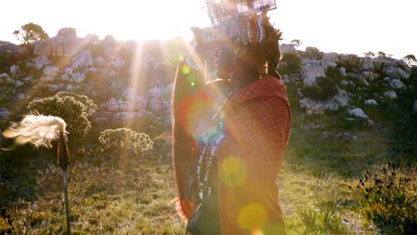 tribal man walking in countryside 4k