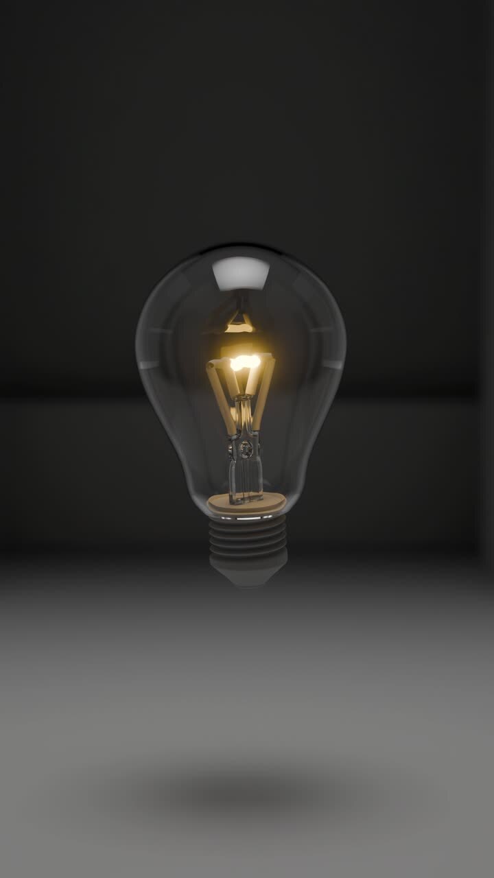 Broken Lightbulb and Illuminated Lightbulb