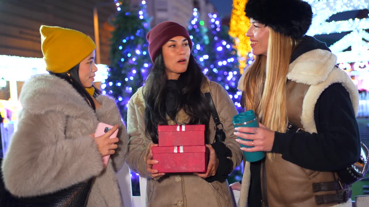 Women Exchanging Gifts at Christmas